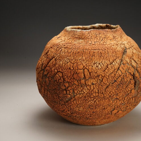 Dry orange ball clay surface moon jar form